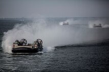 A group of Landing Craft Air Cushioned (LCAC) vessels prepared to embark on the USS Kearsarge (LHD-3) in support of exercise Bold Alligator off the eastern coast of the United States, Oct. 29, 2014. Exercise Bold Alligator 14 is a multi-national, synthetic naval amphibious exercise designed to train across the full range of amphibious capabilities in order to provide unique and contemporary solutions to global challenges. (U.S. Marine Corps photo by Cpl. James R. Skelton/Released)