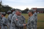 Army Maj. Gen. Judd H. Lyons, left, acting director of the Army National Guard, speaks with a member of the 1636th Cyber Protection Team during a patch ceremony at Fort George G. Meade, Maryland, Tuesday Oct. 7, 2014, where unit members received their shoulder sleeve insignia. The 1636th CPT is the first Army National Guard cyber protection team to be activated and several of its members recently graduated from the Cyber Network Defender Course, with several being named as honor graduates. 