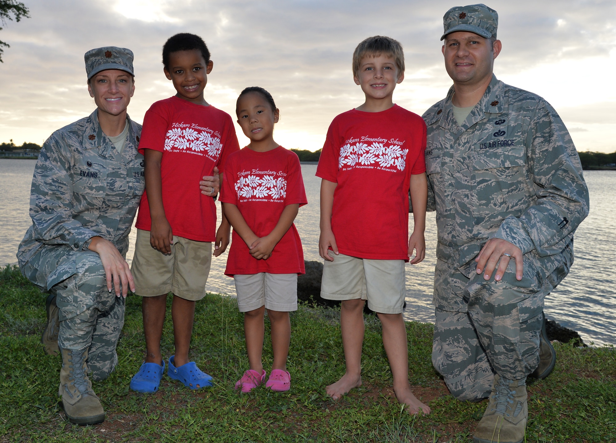 From left, Maj. Amanda Evans, Trevor, Katelyn, Parker, and Maj. Brian Evans pose for a photo Nov. 21, 2014, at Joint Base Pearl Harbor-Hickam, Hawaii. Amanda and Brian adopted Trevor and Katelyn, and Parker is their biological son. Amanda is the 15th Comptroller Squadron commander and Brian is a Special Operations Command Pacific air operations planner. (U.S. Air Force photo/Staff Sgt. Alexander Martinez) 