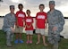 From left, Maj. Amanda Evans, Trevor, Katelyn, Parker, and Maj. Brian Evans pose for a photo Nov. 21, 2014, at Joint Base Pearl Harbor-Hickam, Hawaii. Amanda and Brian adopted Trevor and Katelyn, and Parker is their biological son. Amanda is the 15th Comptroller Squadron commander and Brian is a Special Operations Command Pacific air operations planner. (U.S. Air Force photo/Staff Sgt. Alexander Martinez) 
