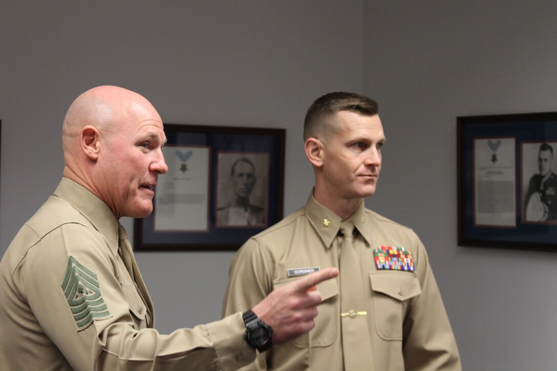 U.S. Marine Corps Sgt. Maj. Michael Barrett, the Sergeant Major of the Marine Corps, and Maj. Ryan A. Gordinier, the commanding officer of Recruiting Station Richmond, speaks to the Marines of RS Richmond during a visit to their headquarters in Richmond, Virginia, Nov. 21, 2014. Barrett visited the RS to pass on knowledge and boost the morale of the recruiters and supporting Marines. (U.S. Marine Corps photo by Cpl. Aaron Diamant/Released)