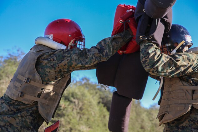 Recruits of Charlie Company, 1st Recruit Training Battalion, face off during a pugil stick bout at Marine Corps Recruit Depot San Diego, Nov. 5. Prior to the Pugil Sticks event, recruits received initial classes on bayonet techniques and ran through a portion of the bayonet assault course. The course was comprised of different obstacles ranging from shallow trenches to crawling under barbed wire.
