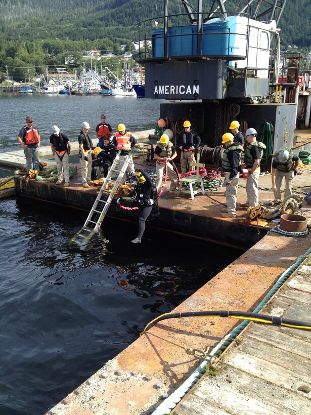 The 7th Dive Detachment begins work in August 2014 to repair the floating breakwaters at Bar Point Harbor in Ketchikan, Alaska.