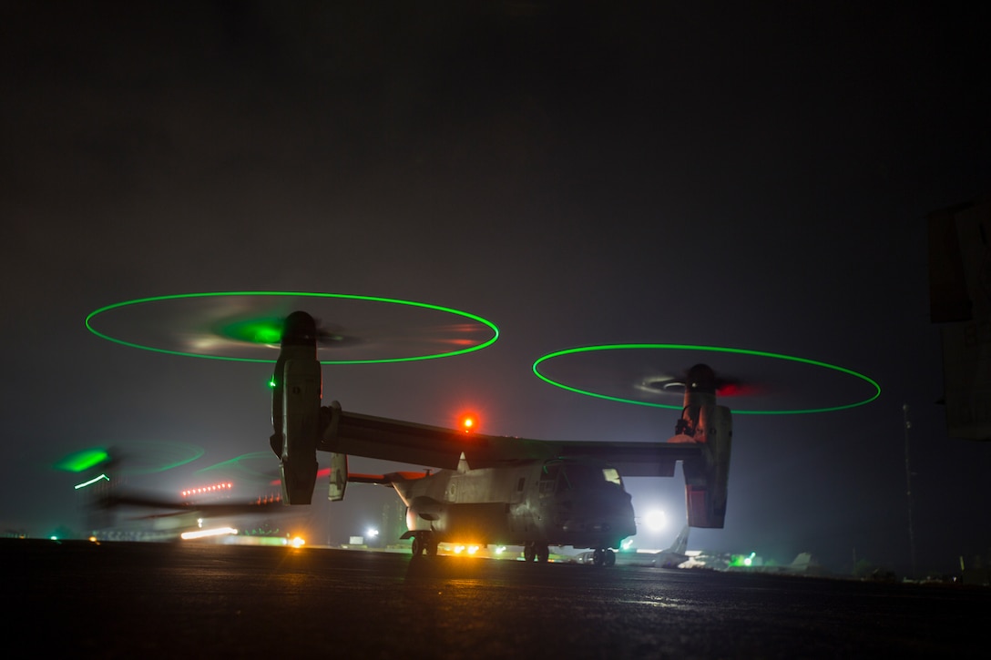 U.S. Marine Corps MV-22B Ospreys with SPMAGTF - Crisis Response - Africa prepare to fly at night as part of required training standards in order for pilots to continue to be qualified to carry passengers at night. while in support of Operation United Assistance in Monrovia, Liberia, Nov. 16, 2014. United Assistance is a Department of Defense operation to provide command and control, logistics, training and engineering support to U.S. Agency for International Development- led efforts to contain the Ebola virus outbreak in West African nations. 