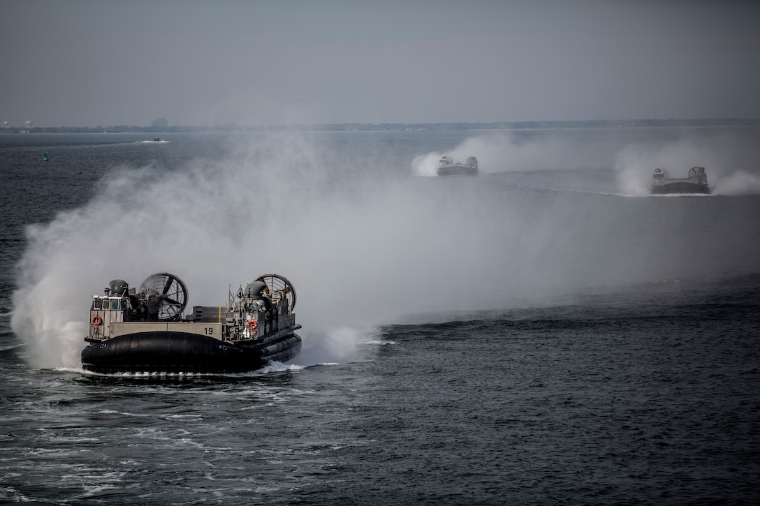A group of Landing Craft Air Cushioned vessels prepared to embark on the USS Kearsarge (LHD-3) in support of exercise Bold Alligator off the eastern coast of the United States, Oct. 29, 2014. Exercise Bold Alligator 14 is a multi-national, synthetic naval amphibious exercise designed to train across the full range of amphibious capabilities in order to provide unique and contemporary solutions to global challenges. 