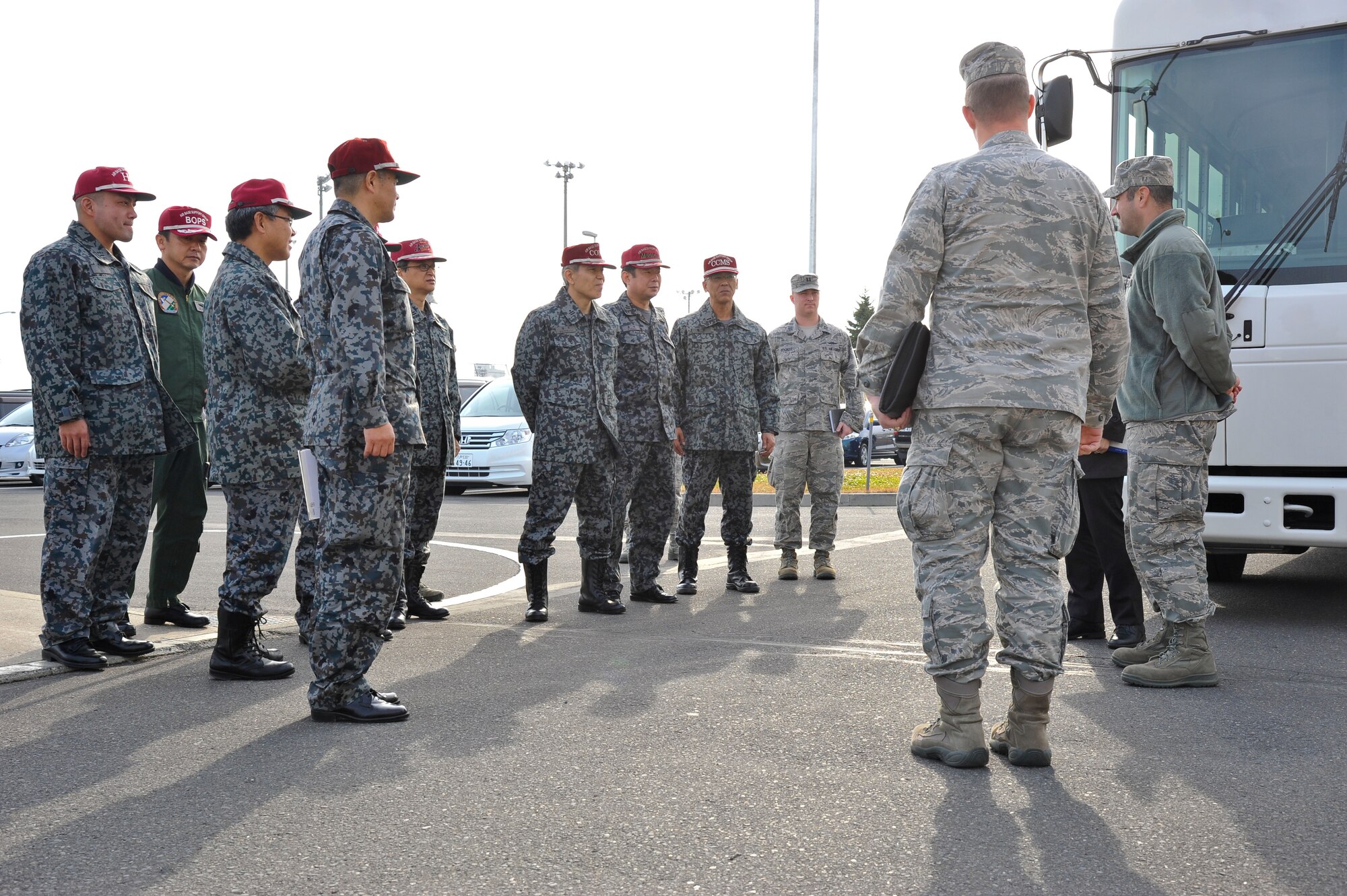 Officers from the Japan Air Self-Defense Force are greeted by members from the 35th Civil Engineer Squadron at Misawa Air Base, Japan, Nov. 25, 2014 . The JASDF toured Misawa as a way to expand the interoperability between U.S. Air Force Airmen and their Japanese counterparts. (U.S. Air Force photo by Airman 1st Class Patrick S. Ciccarone/Released)