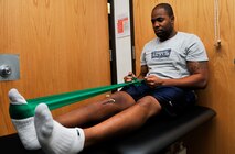 Staff Sgt. Kyle Wimberly, 18th Intelligence Squadron Detachment 2 space systems analyst, performs restricted ankle pumps during a physical therapy session Nov. 25, 2014, on Osan Air Base, Republic of Korea. Wimberly is performing the exercise to regain a full range of motion and flexibility in his knee. (U.S. Air Force photo by Senior Airman David Owsianka)
