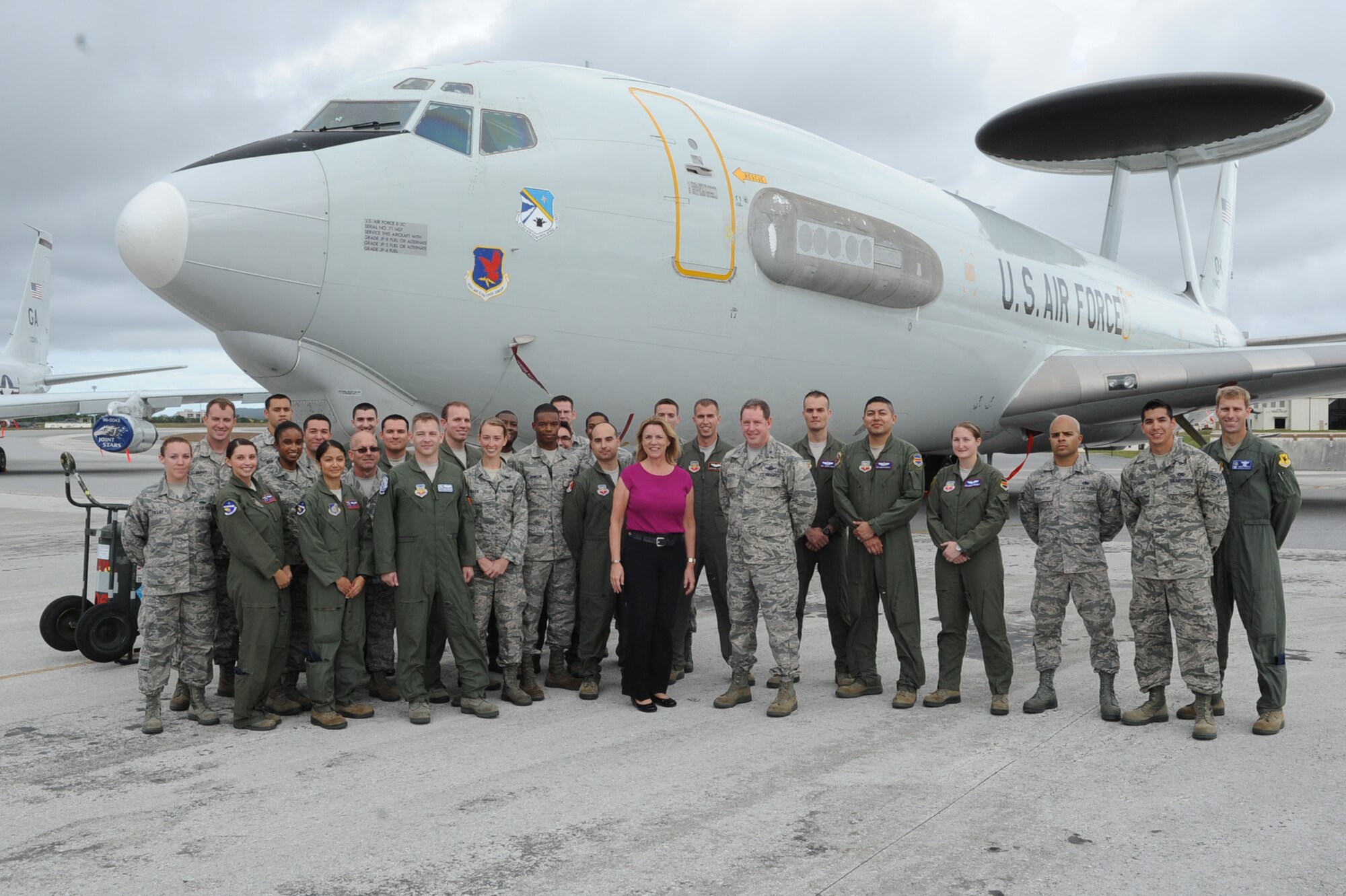 Secretary of the Air Force Deborah Lee James poses with members of the 5th Expeditionary Airborne Command and Control Squadron, 961st Air Combat Control Squadron and 82nd Reconnaissance Squadron during her visit to Kadena Air Base, Okinawa, Japan, Nov. 25, 2014. James met and discussed Air Force policies and goals with Airmen during her visit to Kadena and received a firsthand look at the base's critical role in the Pacific mission, "fight tonight, win tomorrow."