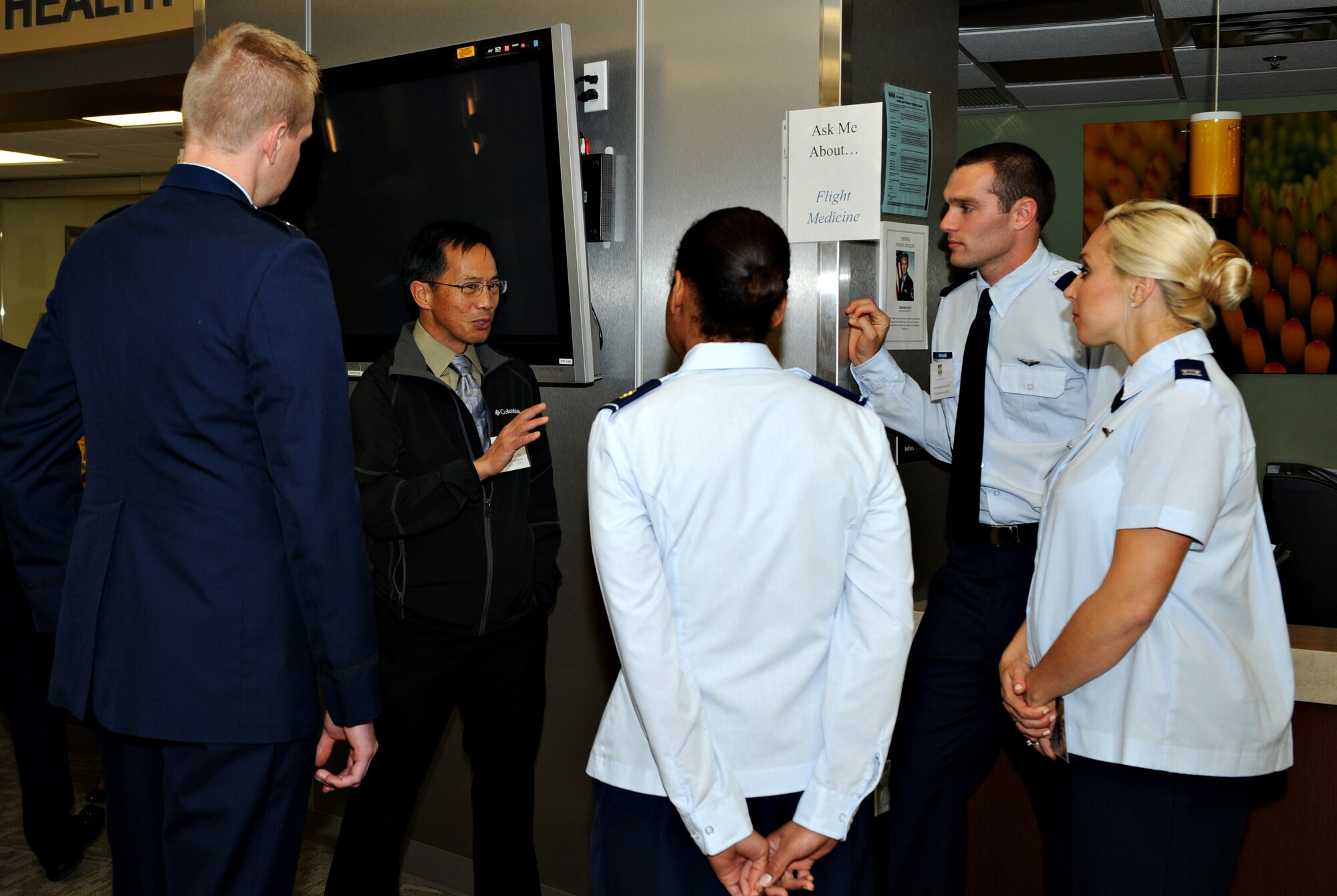 Members of the 9th Medical Group and local healthcare providers converse during an open house hosted by the 9th MDG at Beale Air Force Base, Calif., Nov. 20, 2014. The open house gave the clinic staff an opportunity to strengthen their medical relationship with local healthcare providers. (U.S. Air Force photo by Airman 1st Class Ramon A. Adelan/Released)