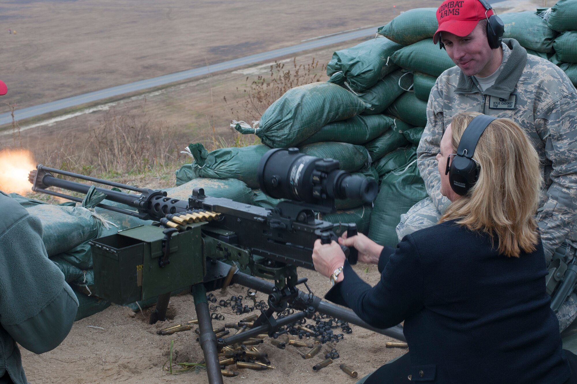 Secretary of the Air Force Deborah Lee James shoots an M-4 caliber machine gun following instruction from Staff Sgt. Kyle Cadoret, 8th Security Forces Squadron combat arms instructor, during her visit to Kunsan Air Base, Republic of Korea, Nov. 22, 2014. During James’ visit, she had the opportunity to experience hands-on demonstrations as she interacted with the Wolf Pack’s combat-ready Airmen. (U.S. Air Force photo by Senior Airman Katrina Heikkinen/Released)