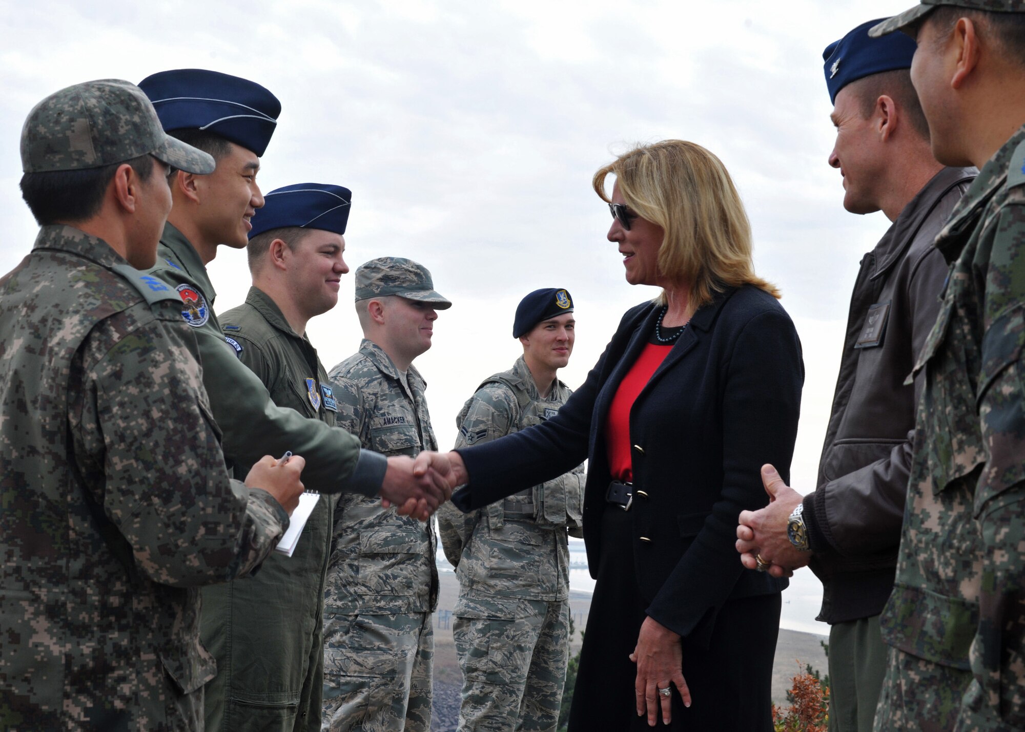 Secretary of the Air Force Deborah Lee James shakes hands with Republic of Korea Air Force  Capt. Park, Ho Min, 38th Fighter Group pilot, after he explains his responsibilities in the 38 FG during her visit to Kunsan Air Base, ROK, Nov. 22, 2014. During James’ visit, she had the opportunity to experience hands-on demonstrations as she interacted with ROKAF and Wolf Pack combat-ready Airmen. (U.S. Air Force photo by Senior Airman Katrina Heikkinen/Released)