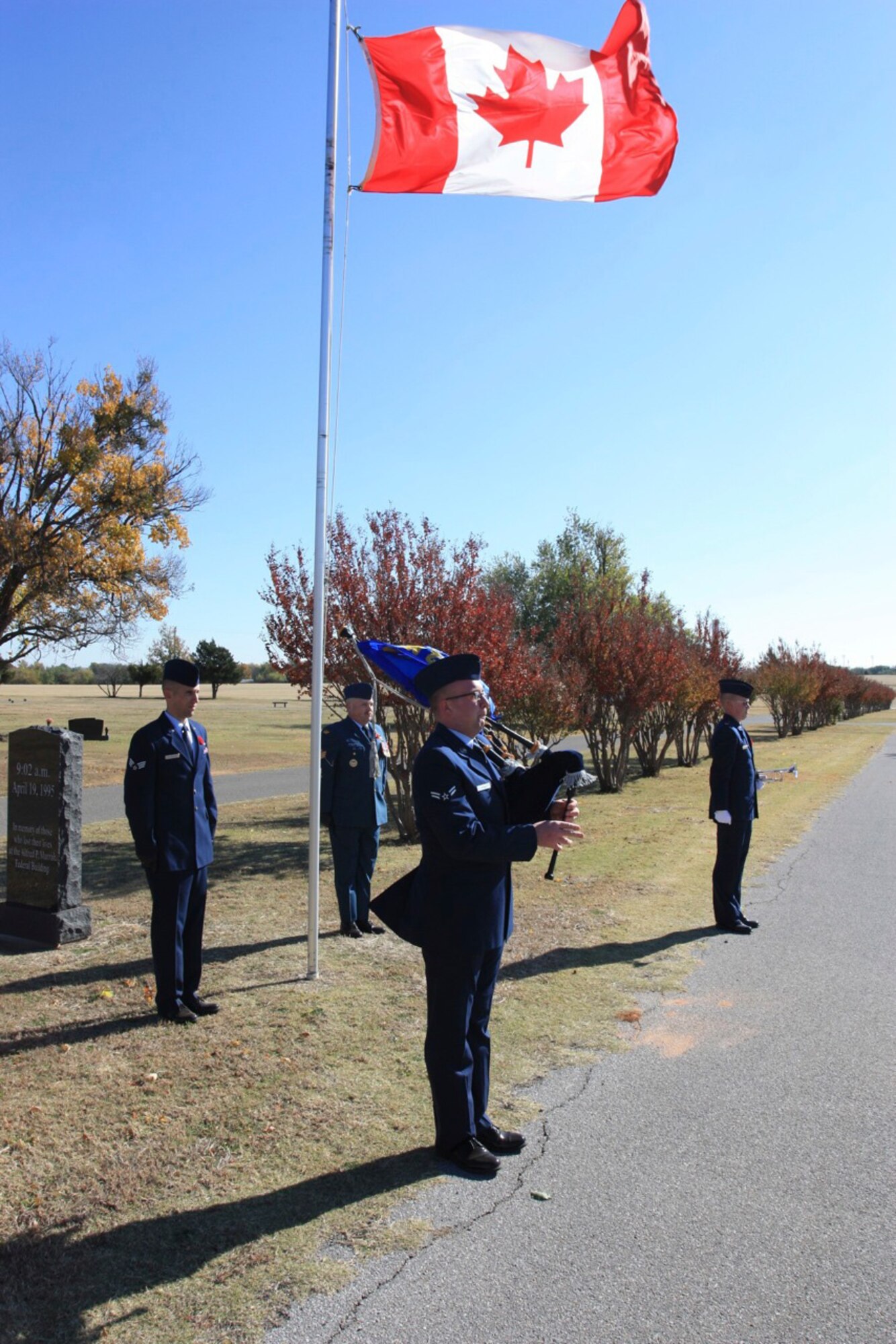 Airman 1st Class Bradley Kenna, with the 552nd Aircraft Maintenance Squadron, plays the bagpipes during a Nov. 11 Remembrance Day ceremony. Canadians and Americans stood together to honor service members from both countries. (Courtesy photo)