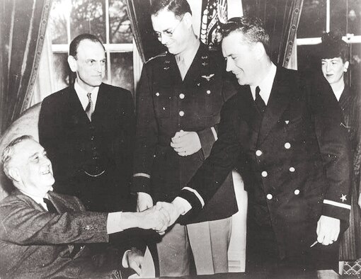 President Franklin D. Roosevelt presents the nation’s first-ever Air Medals, given for valor in flight, to a pair of CAP sub chasers – Maj. Hugh R. Sharp, center, and 1st Lt. Edmund “Eddie” Edwards, second from right, in the Oval Office in February 1943. The two were recognized for their heroic rescue July 21, 1942, of a fellow CAP member, 1st Lt. Henry Cross, whose plane had crashed in the Atlantic 20 miles off the coast of Delaware. Looking on is James M. Landis, wartime chief of the Office of Civilian Defense. By the end of World War II, CAP members had received 824 Air Medals. (Courtesy Photo) 
