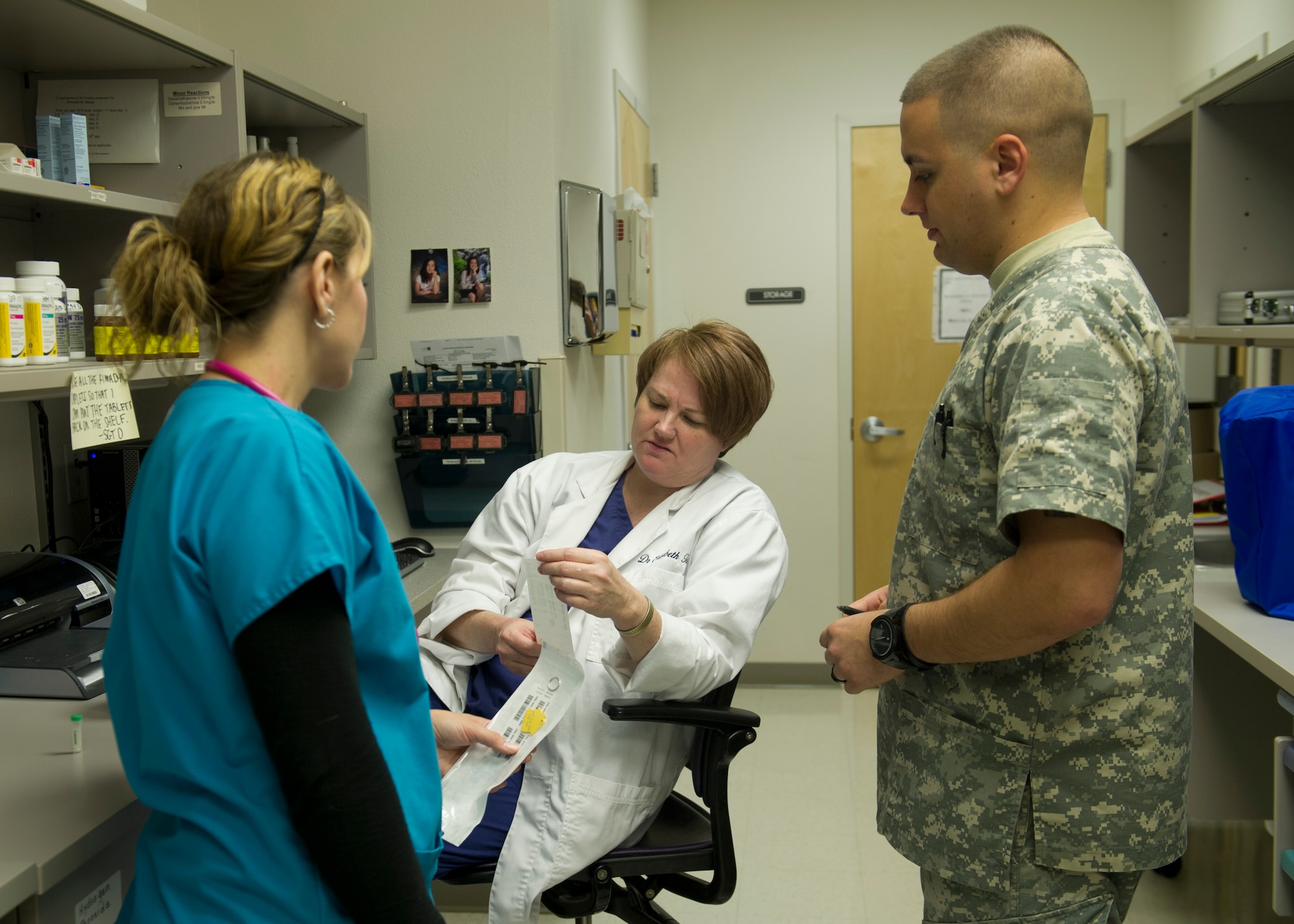 Members of the Veterinarian clinic go over test results from one of their patients at Holloman Air Force Base, N.M., Nov. 19. The Holloman Veterinary Clinic provides care to the pets of active duty and retired military, along with the German Air Force personnel on Holloman. The clinic provides numerous services such as dental work vaccinations, x-rays, and small surgical procedures.  (U.S. Air Force photo by Senior Airman Leah Ferrante/released)