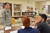 Senior Airman Samantha Maloy, a cook with the 910th Force Support Squadron, discusses an ethical situation with students at Lordstown High School, Nov. 13, 2014. Several Airmen from the 910th Airlift Wing volunteered to teach a Junior Achievement ethics course at the school. (U.S. Air Force photo/Eric M White) 