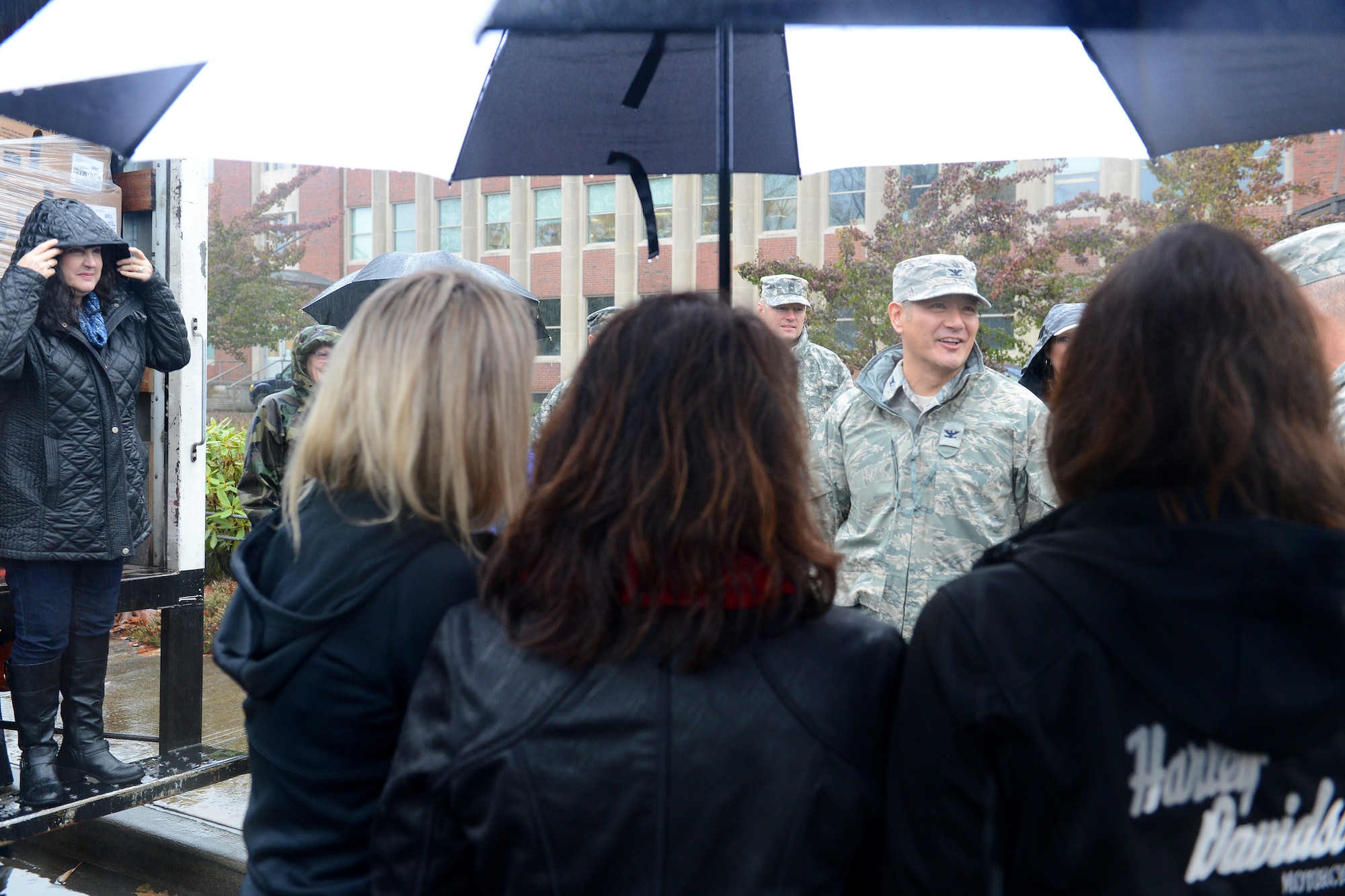 Col. David Kumashiro, 62nd Airlift Wing commander, speaks to the participants of Operation Turkey Drop Nov. 25, 2014, at Joint Base Lewis-McChord, Wash. Operation Turkey Drop was a donation act where money and frozen turkeys were donated, and the turkeys are given to junior enlisted service members. (U.S. Air Force photo/Airman 1st Class Keoni Chavarria)