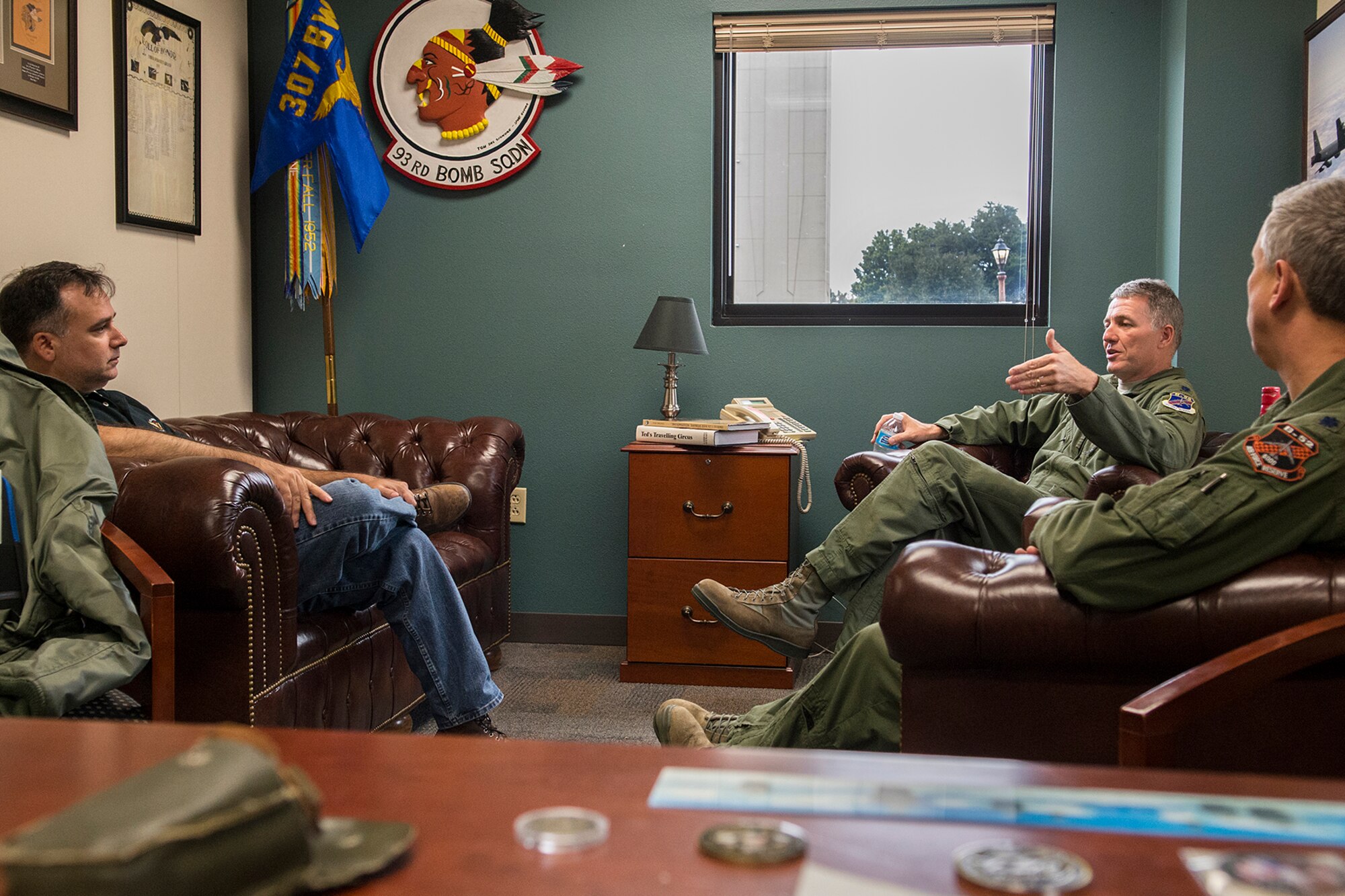 Jose Ramos (left) interviews U.S. Air Force Lt. Cols. Robert Van Hoy, 93rd Bomb Squadron commander, and Robert Burgess, 343rd Bomb Squadron commander, Nov. 20, 2014, Barksdale Air Force Base, La. Ramos is an aviation photographer and is writing a story on the 93rd Bomb Squadron and the B-52H Stratofortress for Combat Aircraft Monthly magazine. (U.S. Air Force photo by Master Sgt. Greg Steele/Released)