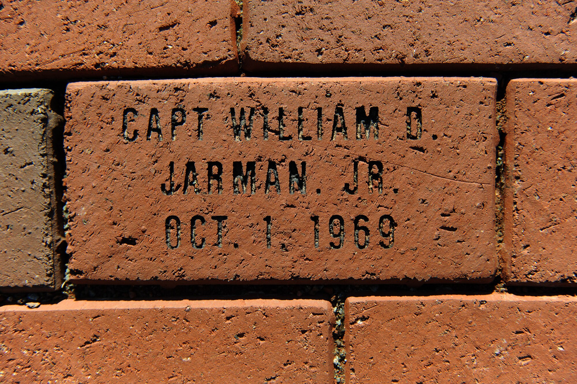 A brick dedicated to Capt. William Jarman Jr., an F-4 Phantom pilot with the 335th Tactical Fighter Squadron during the 1960s, who died in 1969 during an aircraft collision over Fort Bragg, North Carolina, lays in Heritage Park at Seymour Johnson Air Force Base, North Carolina, Nov. 14, 2014. Two bricks are inscribed with his name and service details. Bricks surround the Heritage Park F-15E Strike Eagle memorial fountain, commemorating heroes from the base’s past. (U.S. Air Force photo/Airman 1st Class Aaron Jenne)