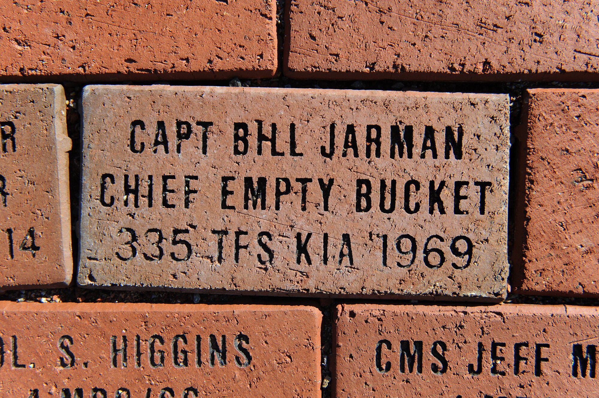 A brick dedicated to Capt. William Jarman Jr., an F-4 Phantom pilot with the 335th Tactical Fighter Squadron during the 1960s, who died in 1969 during an aircraft collision over Fort Bragg, North Carolina, lays in Heritage Park at Seymour Johnson Air Force Base, North Carolina, Nov. 14, 2014. Two bricks are inscribed with his name and service details. Bricks surround the Heritage Park F-15E Strike Eagle memorial fountain, commemorating heroes from the base’s past. (U.S. Air Force photo/Airman 1st Class Aaron Jenne)