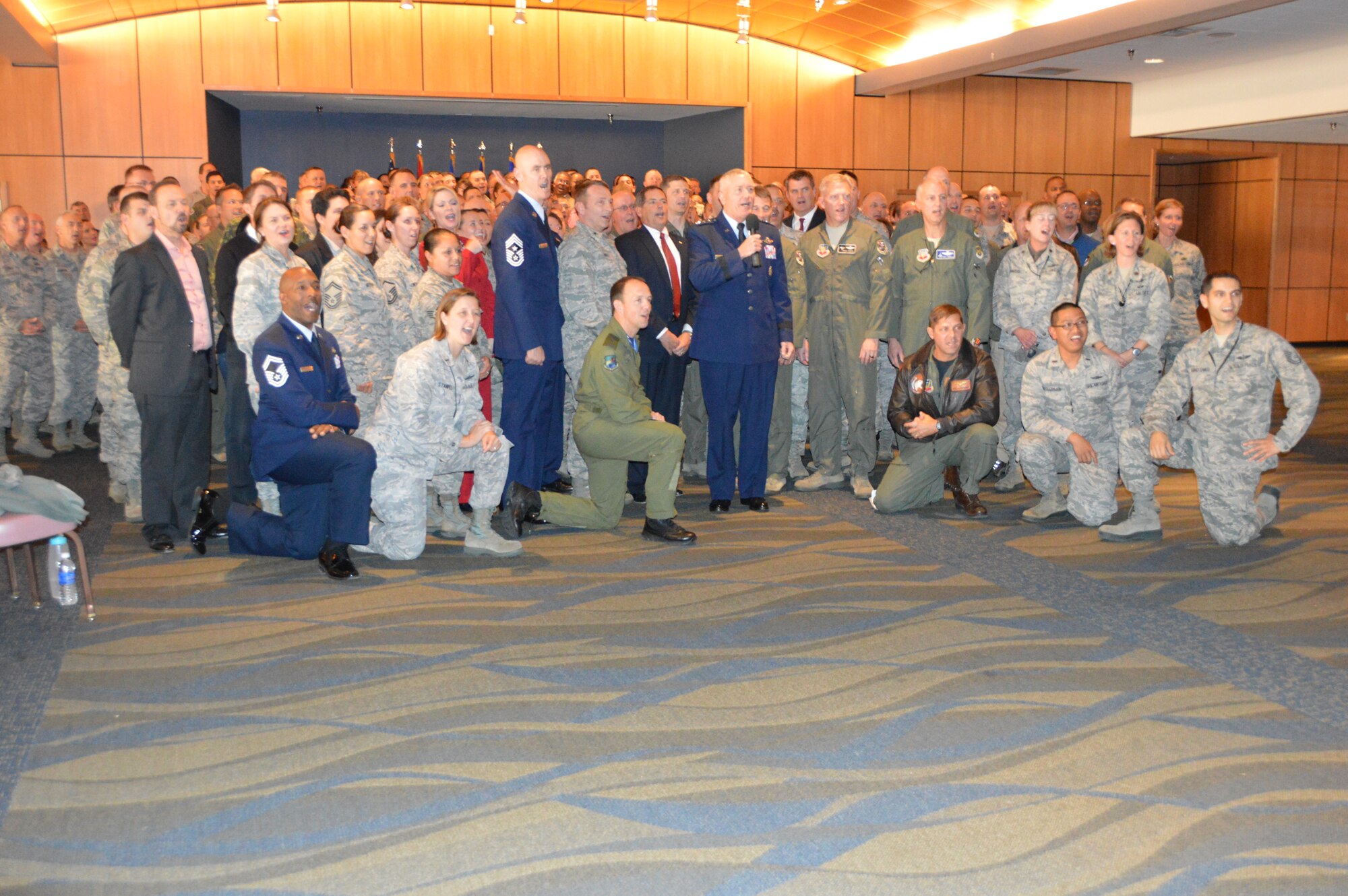 Lt. Gen. William Etter, (center), Continental U.S. Aerospace Defense Command Region-1st Air Force (Air Forces Northern) Commander leads a group from both AFNORTH and the 601st Air and Space Operations Center in recording a seasonal greeting for a holiday video. The group gathered for the greeting following his Commander's Call. (Photo by Mary McHale)