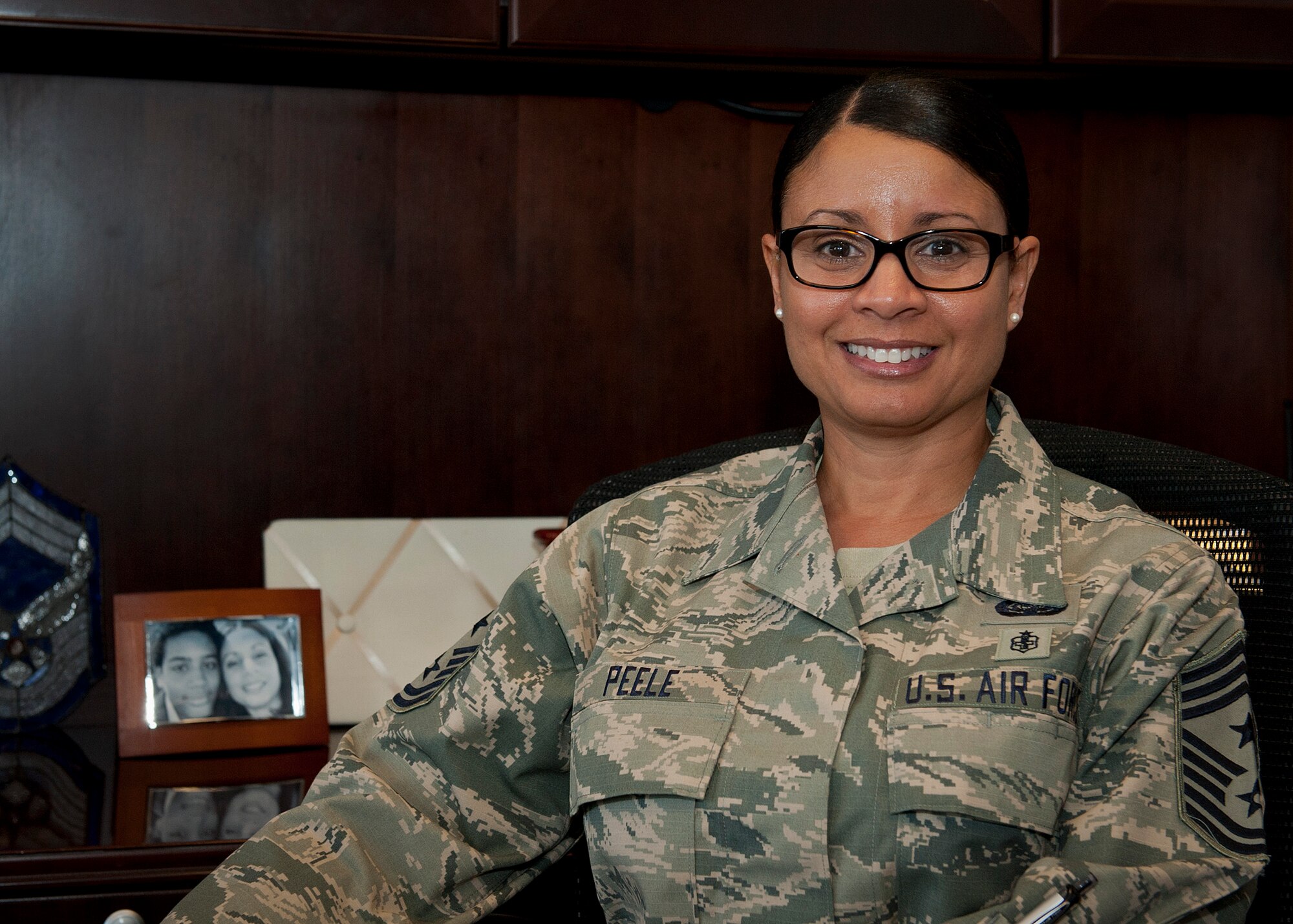 PETERSON AIR FORCE BASE, Colo. – Chief Master Sgt. Idalia Peele, 21st Space Wing command chief, poses for a photo in her office Nov. 17. She hit the ground running when arriving here and has attended many events to get out and meet as many Airmen as she can. (U.S. Air Force photo/Airman 1st Class Rose Gudex)