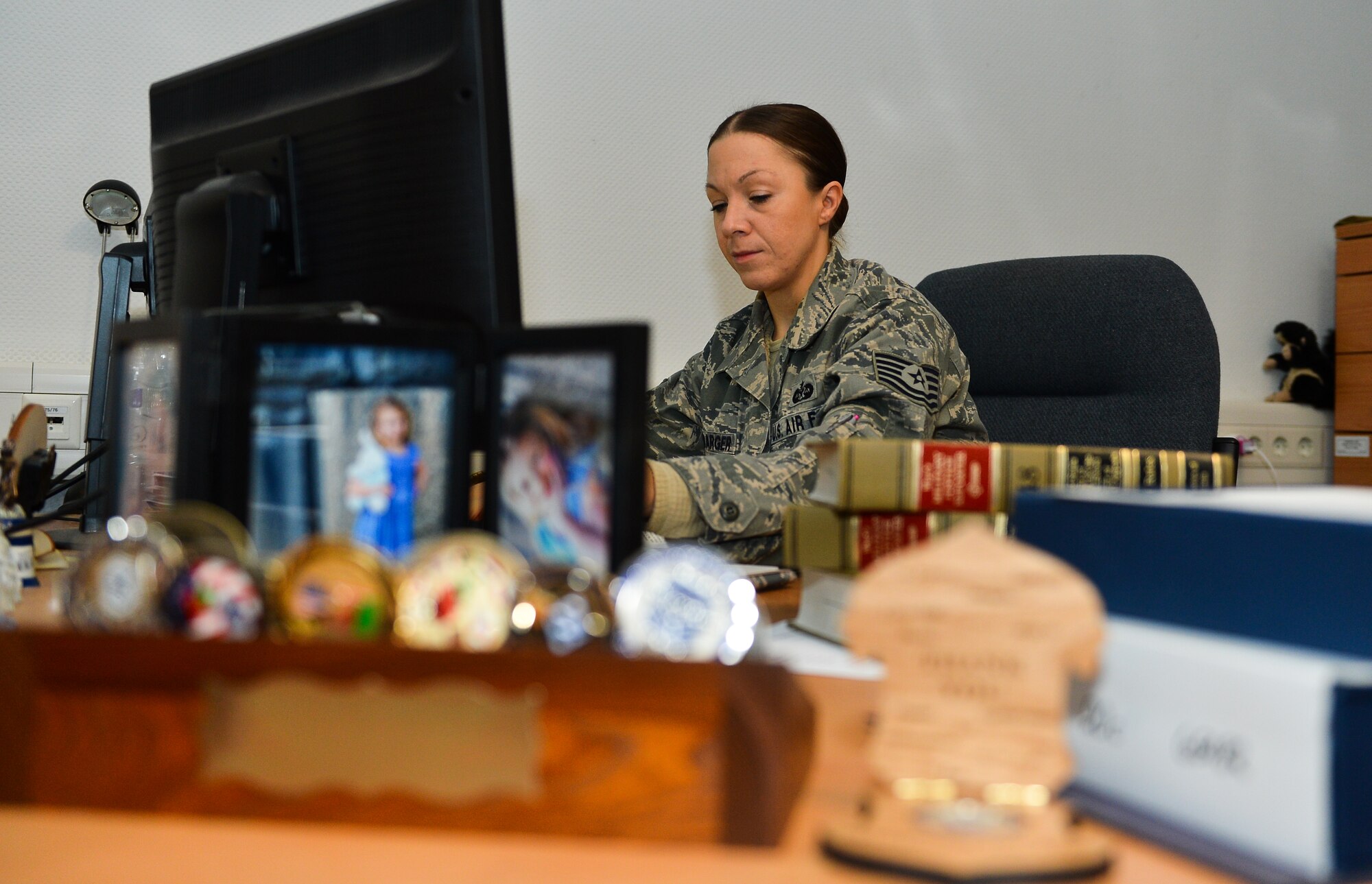 Tech. Sgt. Holly Bambarger, 86th Airlift Wing Judge Advocate paralegal, completes a will for a Ramstein member, Nov. 25, 2014 at Ramstein Air Base, Germany. Bambarger recently won the Air Force Outstanding Paralegal for her accomplishments, demonstrating superior initiative, technical skills, leadership, attorney/paralegal teaming and devotion to duty at home station and overseas locations. (U.S. Air Force photo by Senior Airman Armando A. Schwier-Morales)