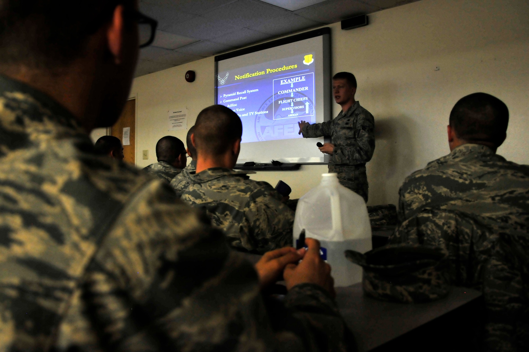 GOODFELLOW AIR FORCE BASE, Texas - Airman 1st Class Jared B. Lunstad, 17th Civil Engineer Squadron emergency management journeymen, instructs a class on what to do in a crisis Nov 19. The briefings cover recalls, severe weather and emergency phone numbers to call. (U.S. Air Force photo/ Airman 1st Class Scott Jackson)