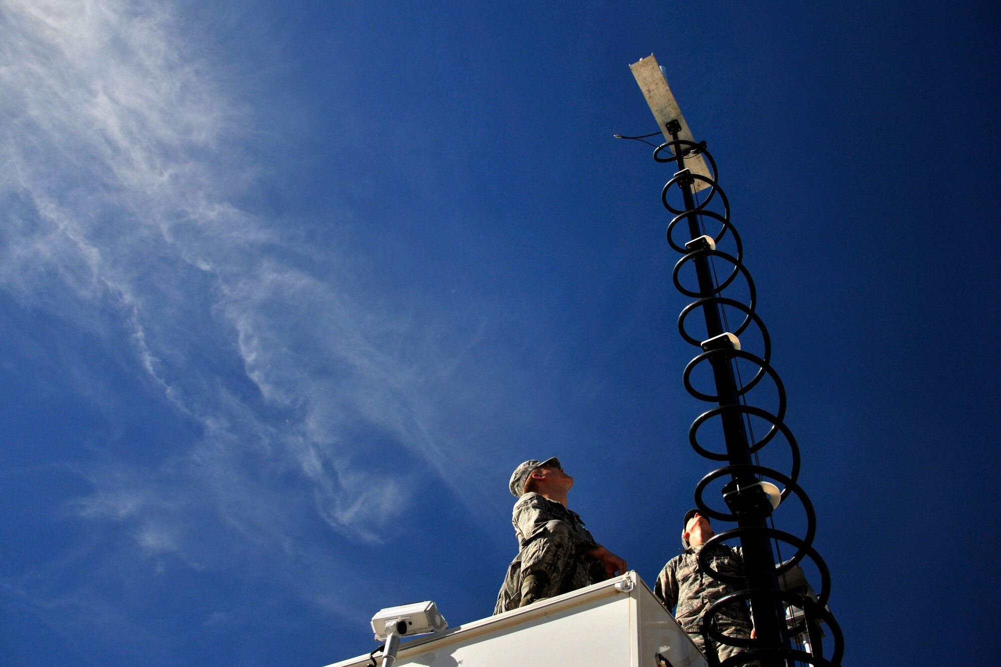 GOODFELLOW AIR FORCE BASE, Texas – Airman 1st Class Jared B. Lunstad and Airman 1st Class Matthew D. Glenn, 17th Civil Engineer Squadron emergency management journeymen, set up an antenna on the Mobile Emergency Operation Center Nov. 19. The MEOC’s purpose is to provide a mobile workstation for those operating in field conditions during an emergency. (U.S. Air force photo/ Airman 1st Class Scott Jackson)