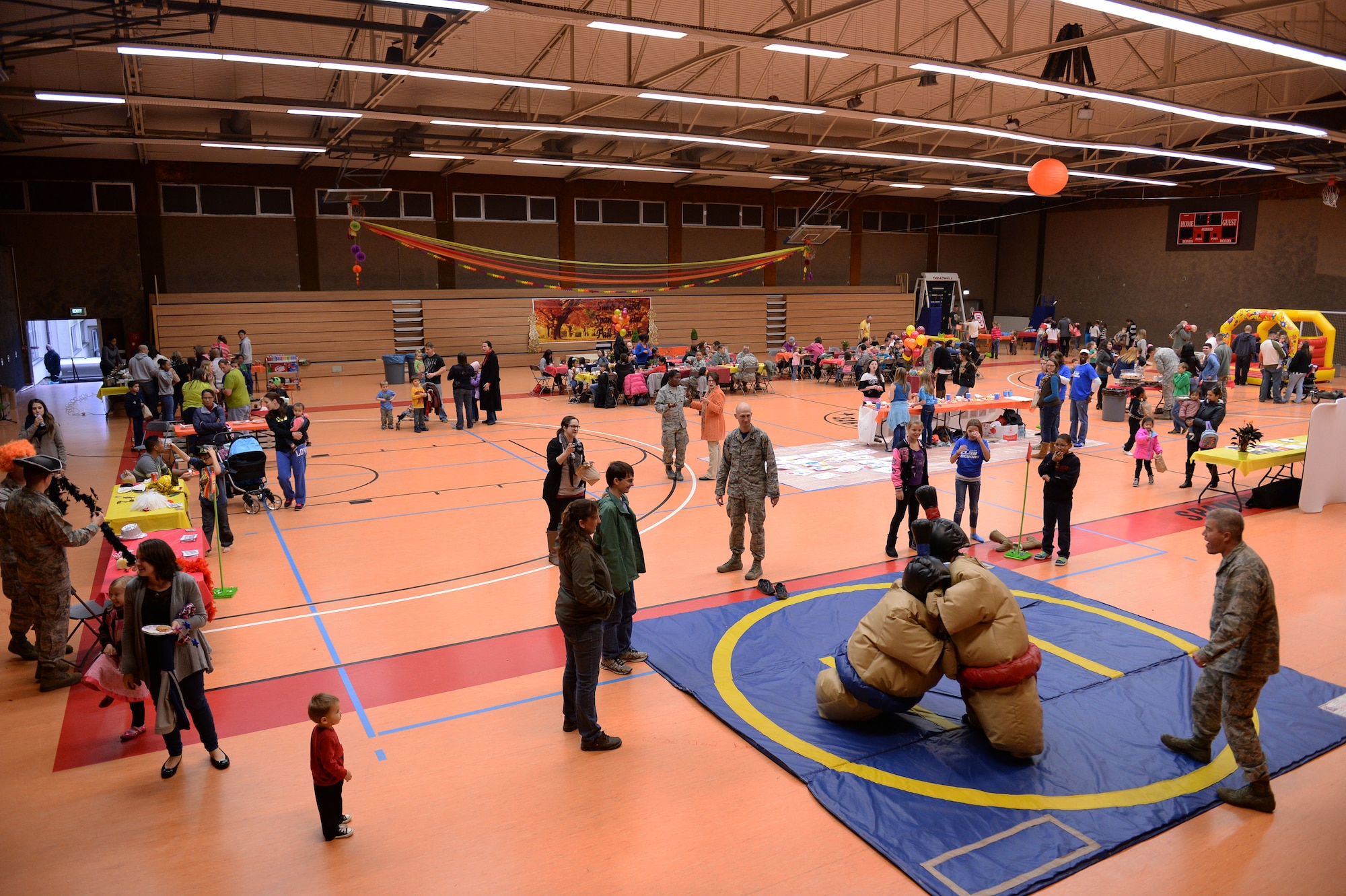 More than 300 people attended the second annual Spangtacular Family Fall Festival Nov. 21, 2014, in the Skelton Memorial Fitness Center at Spangdahlem Air Base, Germany. The event offered the Spangdahlem community a chance to get together for free food, prizes and games to foster camaraderie and spiritual resiliency. (U.S. Air Force photo by Staff Sgt. Daryl Knee/Released)