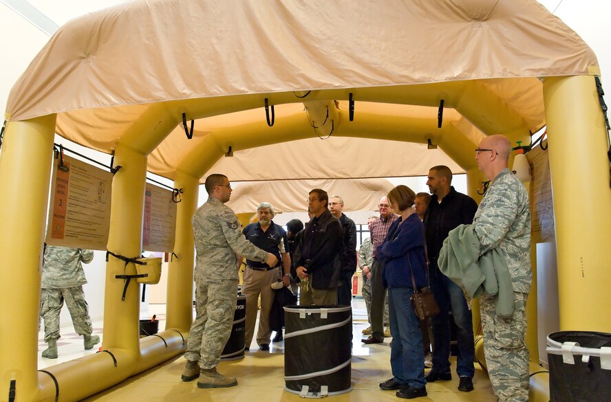 Team Dover honorary commanders, unit commanders and public affairs ambassadors from the 436th and 512th Airlift Wings went on a C-5M Super Galaxy air refueling training flight and tour of 436th Operations Group facilities Oct. 29, 2014, at Dover Air Force Base, Del. Personnel observed the air refueling with two Pennsylvania Air National Guard KC-135T Stratotankers from the 171st Air Refueling Wing, Pittsburgh International Airport, Pa. After the flight, they toured the control tower and the aircrew flight equipment facility. (U.S. Air Force photo/Roland Balik)