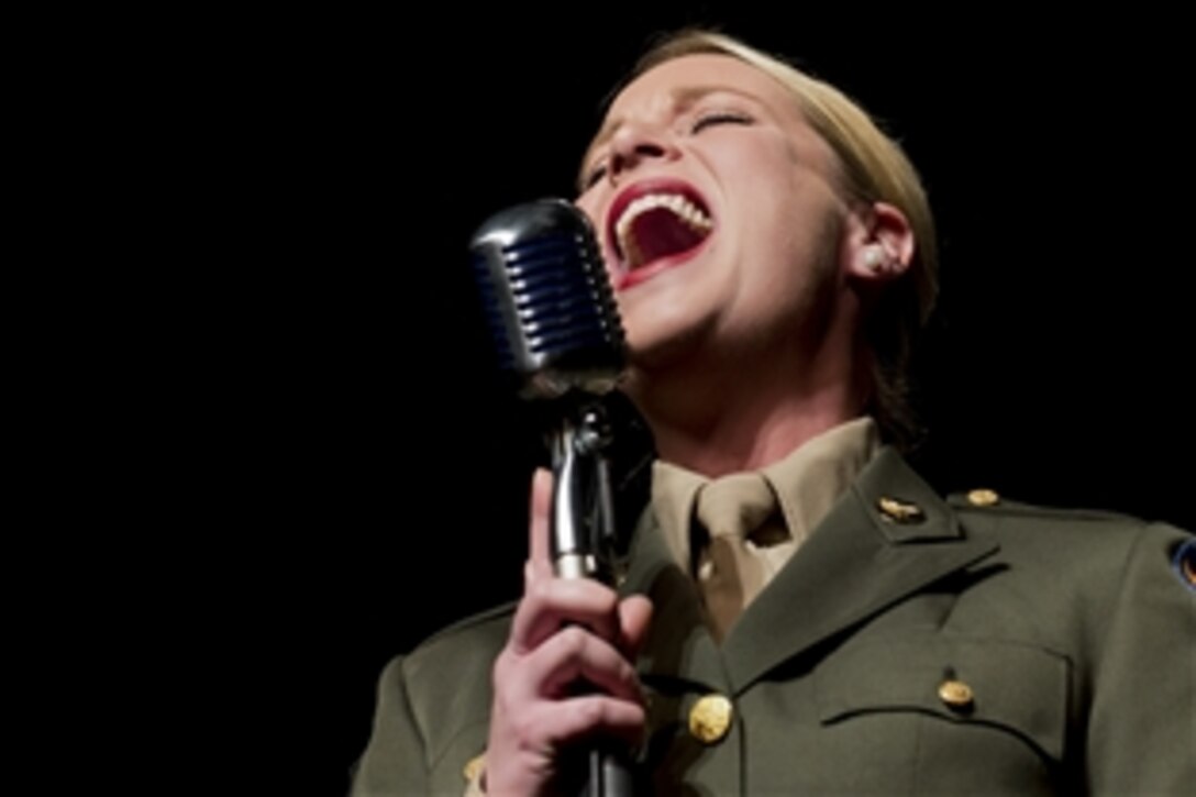 U.S. Air Force Staff Sgt. Jill Diem sings during a Battle of the Bulge 70th anniversary commemoration event in Bastogne, Belgium, Nov. 22, 2014. Diem is a regional vocalist for the U.S. Air Forces in Europe Band.