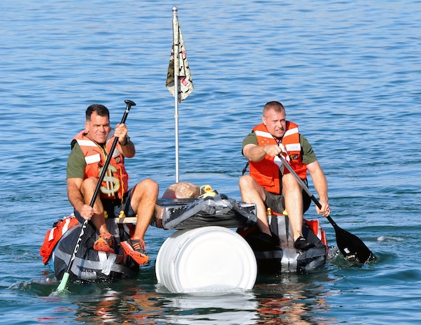 Lt. Col. Robert Bailey, director of the Amphibious Vehicle Test Branch, and Master Sgt. Michael Chouinard, AVTB staff noncommissioned officer in charge, row their team’s makeshift boat Nov. 21 at Camp Pendleton, Calif. AVTB, a subordinate unit of Marine Corps Systems Command, held its inaugural bathtub race where participants were challenged to build boats out of scavenged and recycled materials.