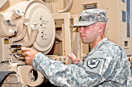 Army Spc. Zachariah Deans conducts a preventive maintenance inspection on a light medium tactical vehicle at the Papago Park Military Reservation in Phoenix. Deans is a member of the Arizona National Guard’s 153rd Brigade Support Battalion and works full time at Canyon State Academy as a group leader for disadvantaged youth. 