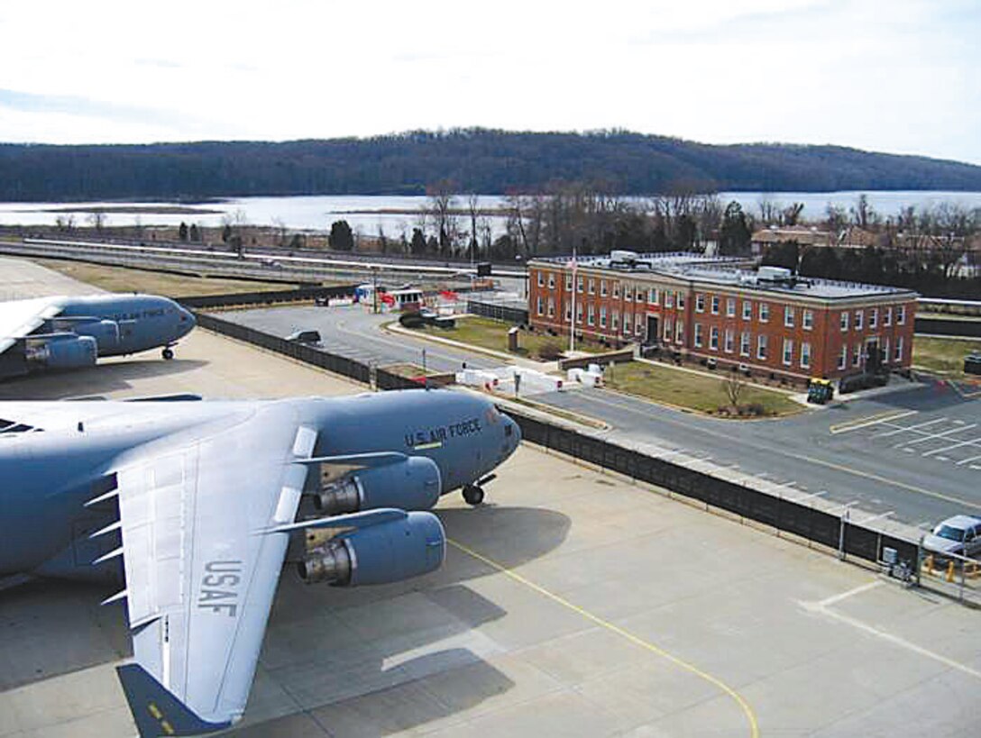 Two Air Force C-17 transport planes sit on the tarmac just in front of the headquarters building at Marine Corps Air Facility Quantico during this undated picture.