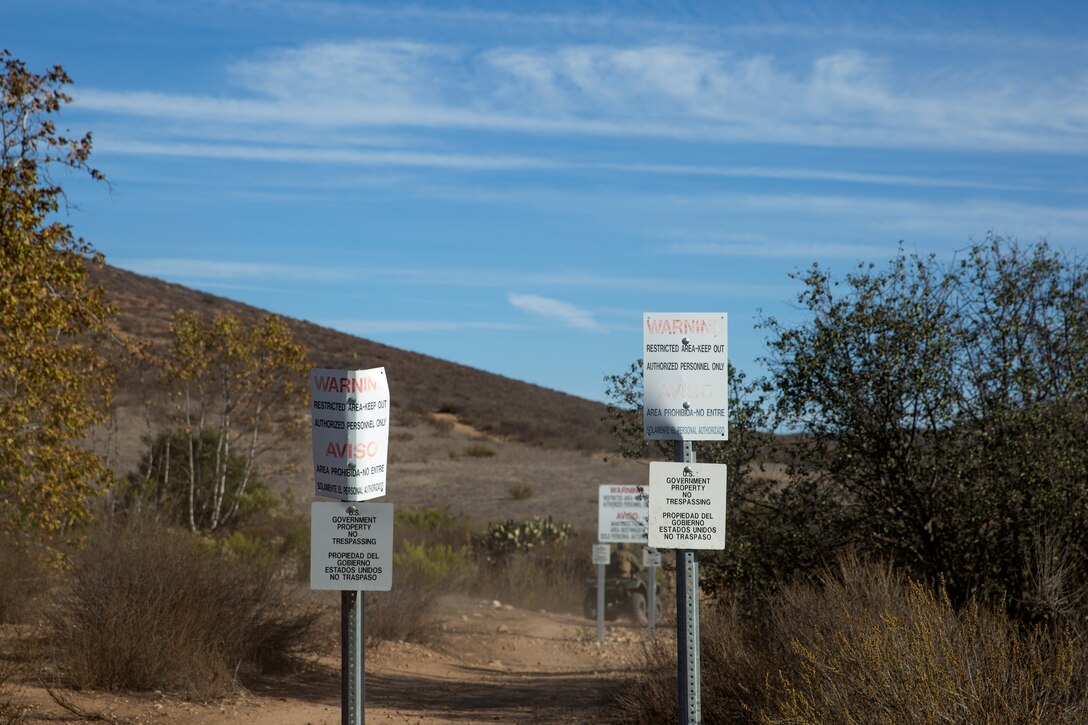 Signs meant to deter trespassers stand posted around the installations borders aboard Marine Corps Air Station Miramar, Calif., Nov. 24. Special Reaction Teams with the Miramar and Marine Corps Recruit Depot San Diego Provost Marshal’s Offices came together for a routine all-terrain vehicle patrol of the eastern portion of Miramar for training and to keep the public safely off the installation.