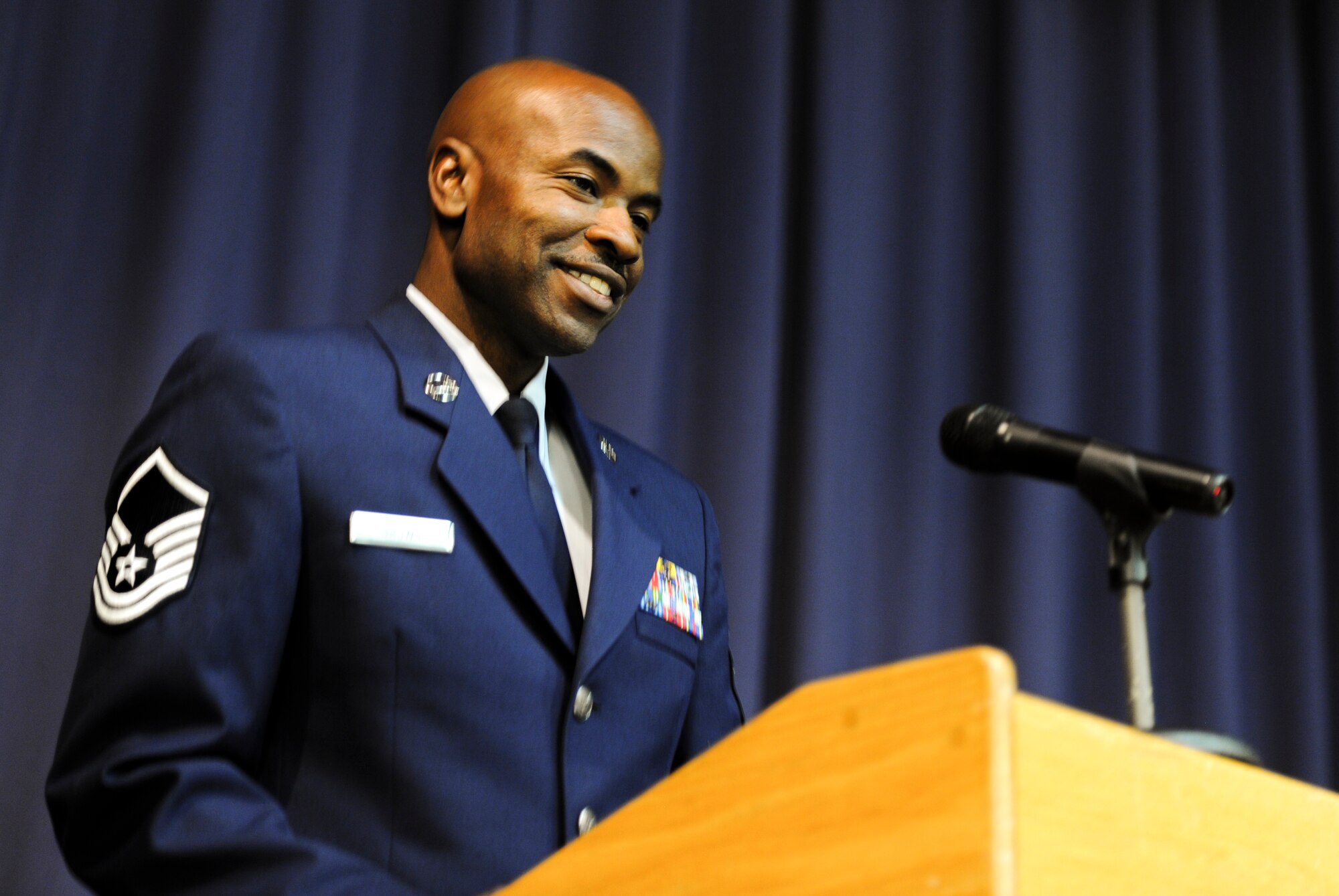 Master Sgt. Tommy Brown, Air Force Special Operations Command, speaks during an NCO-Induction ceremony at Hurlburt Field, Fla., Nov. 26, 2014. An NCO-Induction ceremony is a time-honored tradition of welcoming the newest military leaders. (U.S. Air Force photo/Senior Airman Christopher Callaway)