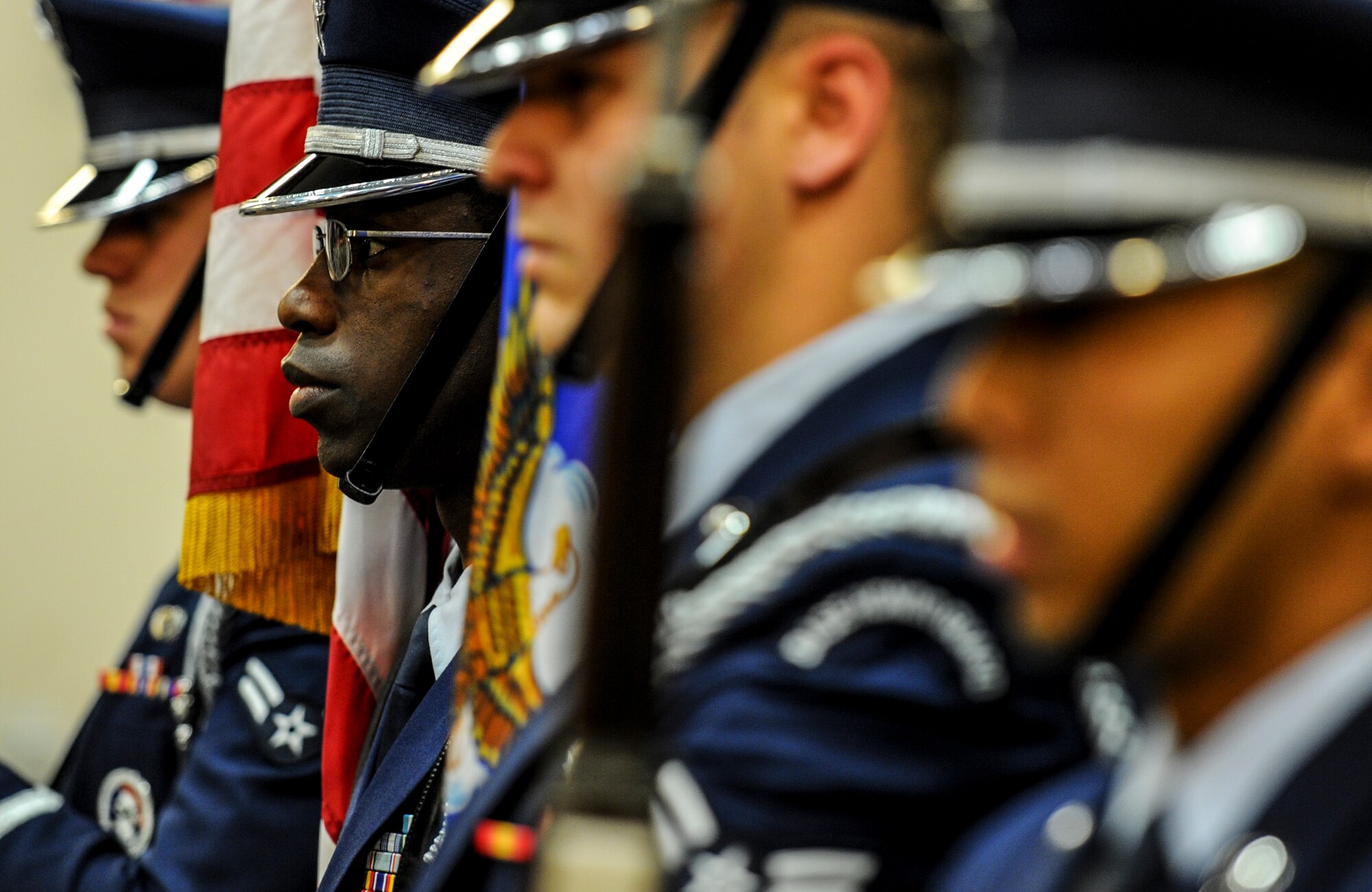 The Hurlburt Field honor guard posts the colors during an NCO-induction ceremony at Hurlburt Field, Fla., Nov. 26, 2014. An NCO-Induction ceremony is a time-honored tradition of welcoming the newest military leaders. (U.S. Air Force photo/Senior Airman Christopher Callaway)