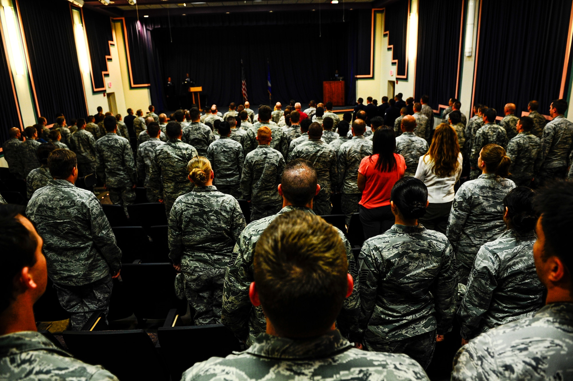 Members from Hurlburt Field stand during the departure of the official party after an NCO-induction ceremony at Hurlburt Field, Fla., Nov. 26, 2014. An NCO-Induction ceremony is a time-honored tradition of welcoming the newest military leaders. (U.S. Air Force photo/Senior Airman Christopher Callaway)