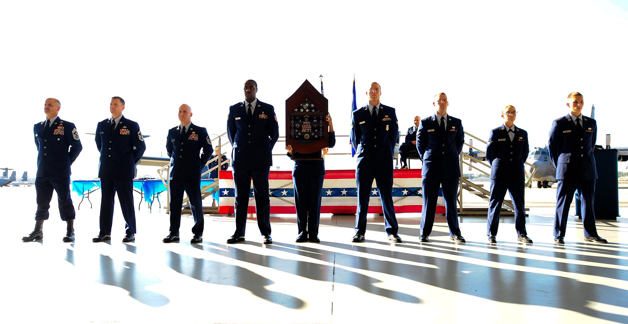 1st Special Operations Wing enlisted Air Commandos present Chief Master Sgt. Jeff Maberry’s shadow box at his retirement on Hurlburt Field, Fla., Nov. 21, 2014. The line of Airmen, Airman Basic through Chief Master Sgt., represents the Air Force enlisted force, which is a diverse group of functionally and operationally specialized Airmen. 