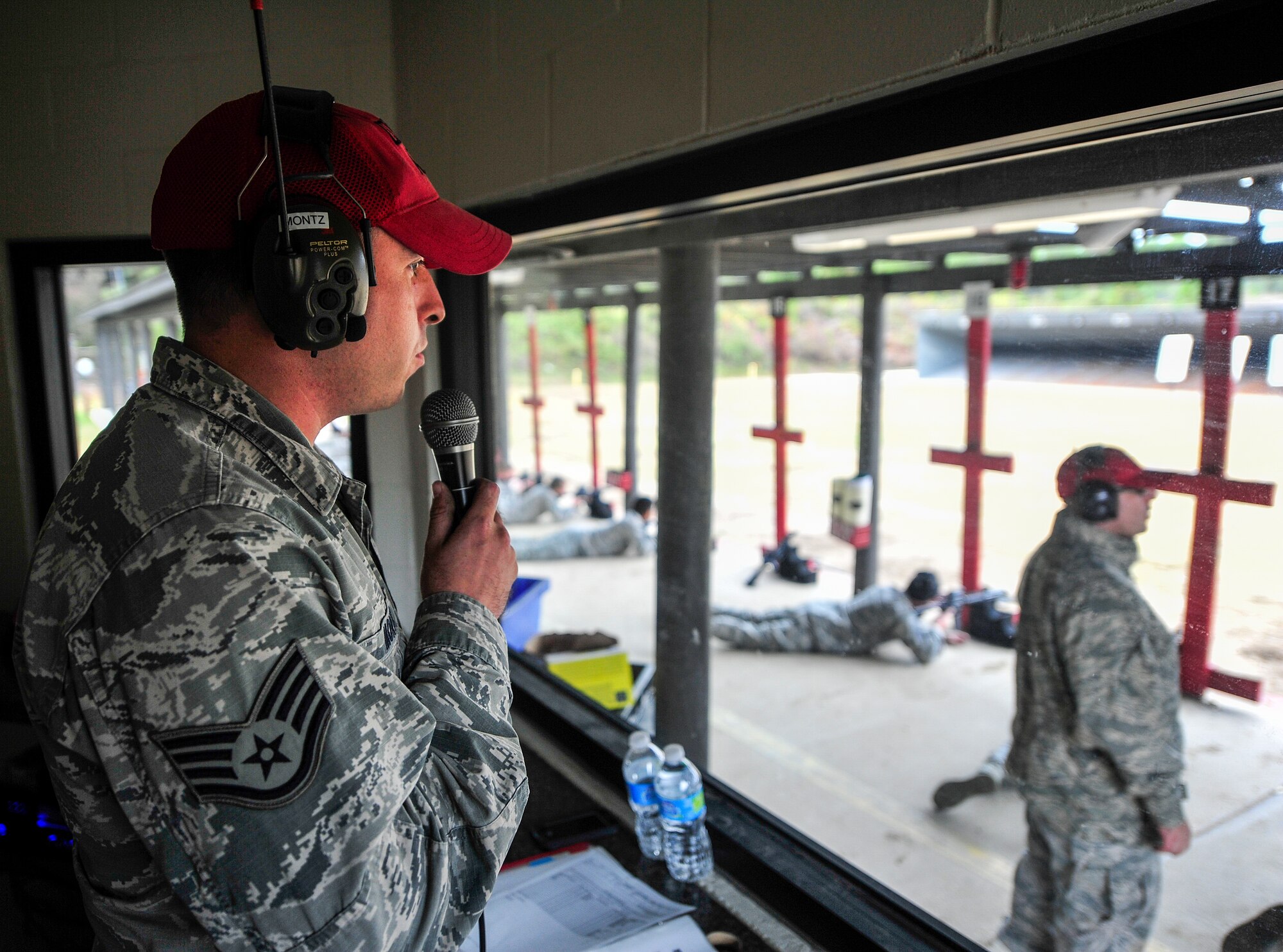 Staff Sgt. Anthony Montz, 1st Special Operations Security Forces Squadron Combat Arms Training and Maintenance instructor, gives instructions during small arms training at Hurlburt Field, Fla., Nov. 13, 2014. CATM instructors train and qualify Airmen on required weapons needed for deployments. (U.S. Air Force photo/Airman 1st Class Jeff Parkinson)