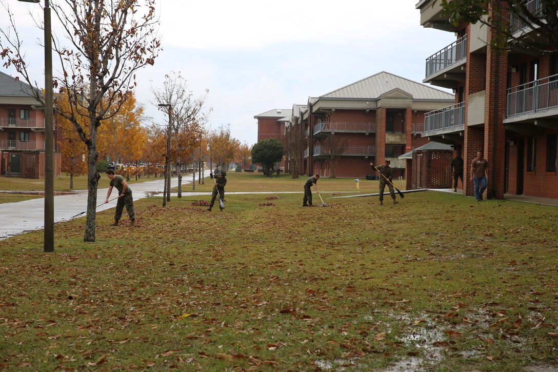 Marines with Marine Air Control Group 28 rake outside of barracks 4295 at Marine Corps Air Station Cherry Point, N.C., Nov. 25, 2014. Staff noncommissioned officers and officers with MACG-28 cleaned the barracks in an effort to improve living condition for junior Marines. The Marines worked on various projects including painting, power washing and fixing furniture in the common areas. 
