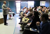 Clay Weisenberger (standing), Huntsville Center Office of Counsel, conducts ethics training to Huntsville Center employees Nov. 25 in the Huntsville Center cafeteria. Ethics training is an annual mandatory face-to-face requirement for all government employees. Army Corps of Engineers policy states that deployed personnel are exempt from the annual training requirement but are required to take it as soon as possible after they return. Additional sessions are scheduled through Dec.10.                            