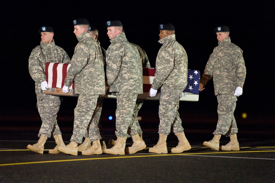 A U.S. Army carry team transfers the remains of Army Spc. Joseph W. Riley of Grove City, Ohio, Nov. 26, 2014, at Dover Air Force Base, Del. Riley was assigned to 1st Battalion, 508th Parachute Infantry Regiment, 3rd Brigade Combat Team, 82nd Airborne Division, Fort Bragg, N.C. (U.S. Air Force photo/Roland Balik)
