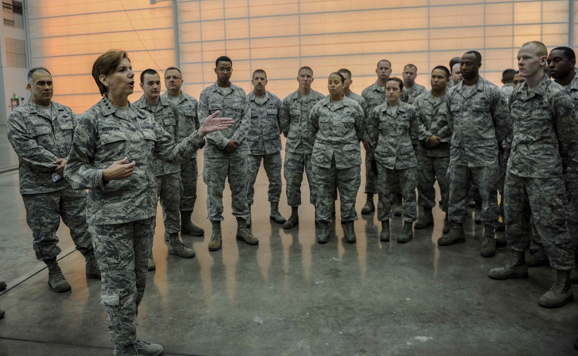 Gen. Lori Robinson, Pacific Air Forces commander, speaks to active duty and guard maintenance Airmen during her visit to a maintenance hangar on Joint Base Pearl Harbor-Hickam, Hawaii, Nov. 25, 2014. General Robinson conducted her initial base tour to gain a better understanding of unit readiness and base capabilities and services while interacting with Airmen face-to-face. (U.S. Air Force photo by Tech. Sgt. Terri Paden/RELEASED)