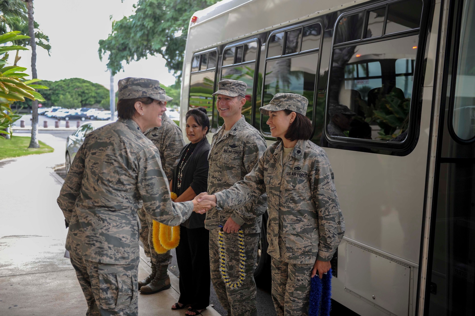 Gen. Lori Robinson, Pacific Air Forces commander, shakes hands with Lt. Col. Sara Huiss, 515th Air Mobility Operations Wing commander, during her visit to Joint Base Pearl Harbor-Hickam, Hawaii, Nov. 25, 2014. General Robinson conducted her initial base tour to gain a better understanding of unit readiness and base capabilities and services while interacting with Airmen face-to-face. (U.S. Air Force photo by Tech. Sgt. Terri Paden/RELEASED)