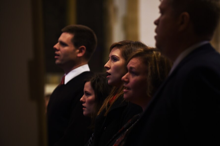 British and American patrons sing hymns during an Ecumenical Thanksgiving Service at St. Edburg's Church, Bicester, England, Nov. 26, 2014. The service allowed Airmen and families from RAF Croughton to interact and share the holiday with neighbors in the local community. (U.S. Air Force photo by Staff Sgt. Jarad A. Denton/Released)