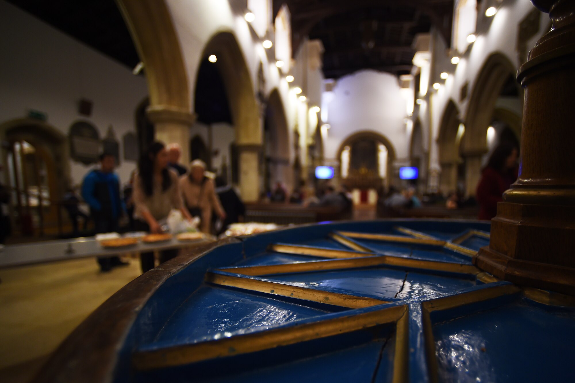 British and American patrons deliver pies and other food items during an Ecumenical Thanksgiving Service at St. Edburg's Church, Bicester, England, Nov. 26, 2014. Following the service, those in attendance enjoyed the food provided in the spirit of bilateral friendship. (U.S. Air Force photo by Staff Sgt. Jarad A. Denton/Released)
