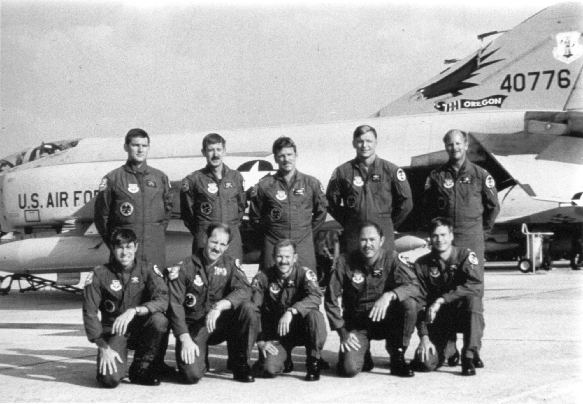 Redhawk aircrew participating are shown here, with F-4C-23-MC 64-0776 as the backdrop, from left to right – Standing:  Maj Bill DeJager (Top Gun WSO), Capt Steve Allison, Capt Dick Peterson, Maj Terry McKinsey and Maj Carl Hellis.  Kneeling:  Maj Ron Moore (Top Gun pilot), Capt Larry Kemp, Lt Col Ray Pilcher, Maj Scott Powell and Maj Dennis Anderson.  Aircraft 776 is preserved today at the Boeing Museum of Flight in Seattle, WA.  (142FW/HO Archives)