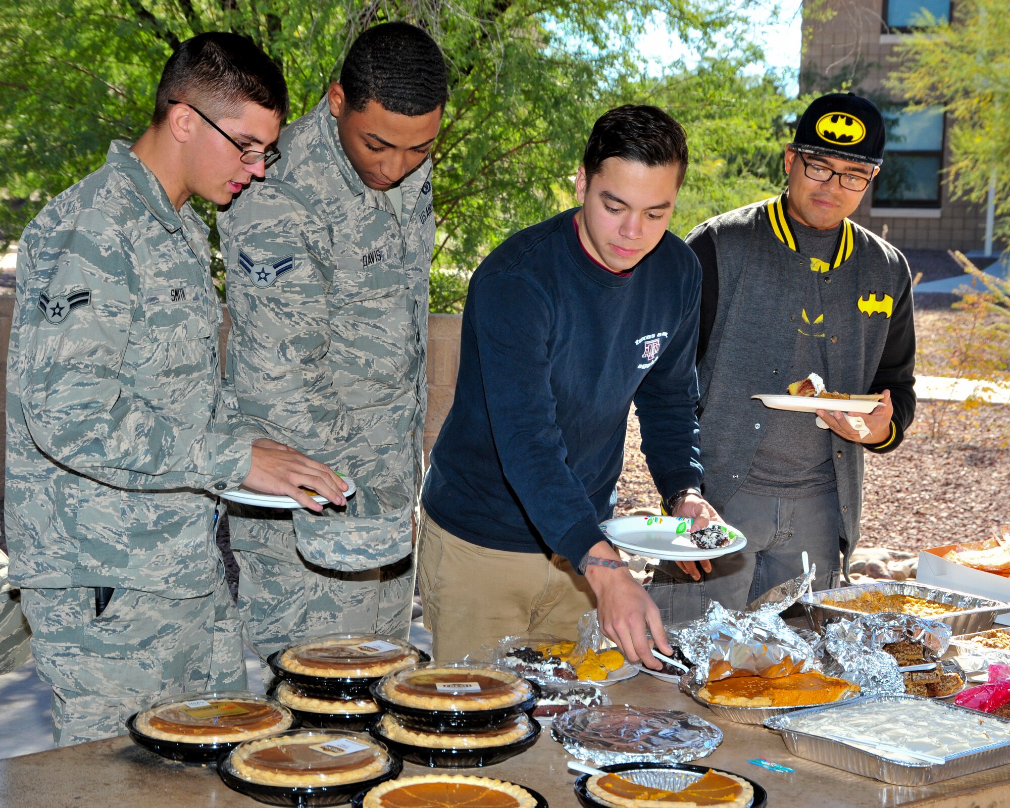U.S. Air Force Airmen review dessert options during a Thanksgiving Dorm Bash held at Davis-Monthan Air Force Base, Ariz., Nov. 25, 2014. The bash was held for dorm residents, who may not be going home for the holiday, the opportunity to enjoy a home-cooked meal. (U.S. Air Force Photo by Airman 1st Class Chris Massey/Released)