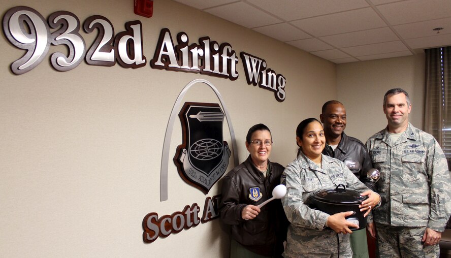 We are pleased to announce and also congratulate yesterday's Chili Cook Off winners:
From left:  Best Chili overall: Senior Master Sgt. Marianne Badger; Most Unique Chili:  Senior Master Sgt. Terri Ray,  Best Use of Spice:  First Lt. Liz Wszalek (not pictured) and 
also Best Chili Overall: Senior Master Sgt. Dave Brown.  They were all presented gift cards and a big "thanks" from the wing commander, Col. Karl Goerke following an intense juding completion which included a run off taste test to break a tie.  The chili event followed the November 25 civilian commander's call meeting.  (U.S. Air Force photo/Maj. Stan Paregien)